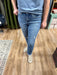 medium wash denim, tan side stitching along both side hems, Howdy embroidered on right pocket