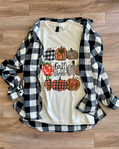 cream colored tee with different patterned pumpkins and fall is my favorite text.  Tee paired with b;ack/white flannel in picture.  Pieces sold separately.  