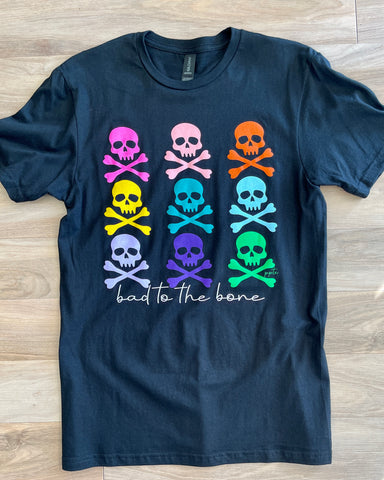 Black unisex tee, with text bad to the bone and 9 colorful skull and crossbones
