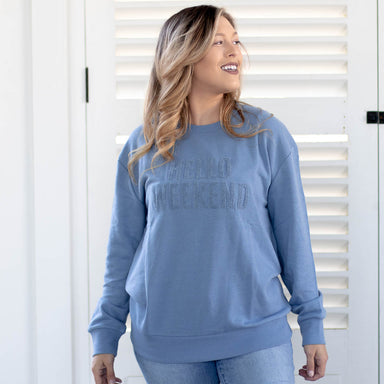 slate blue long sleeve crew neck sweatshirt with Hello Weekend in embroidered letters