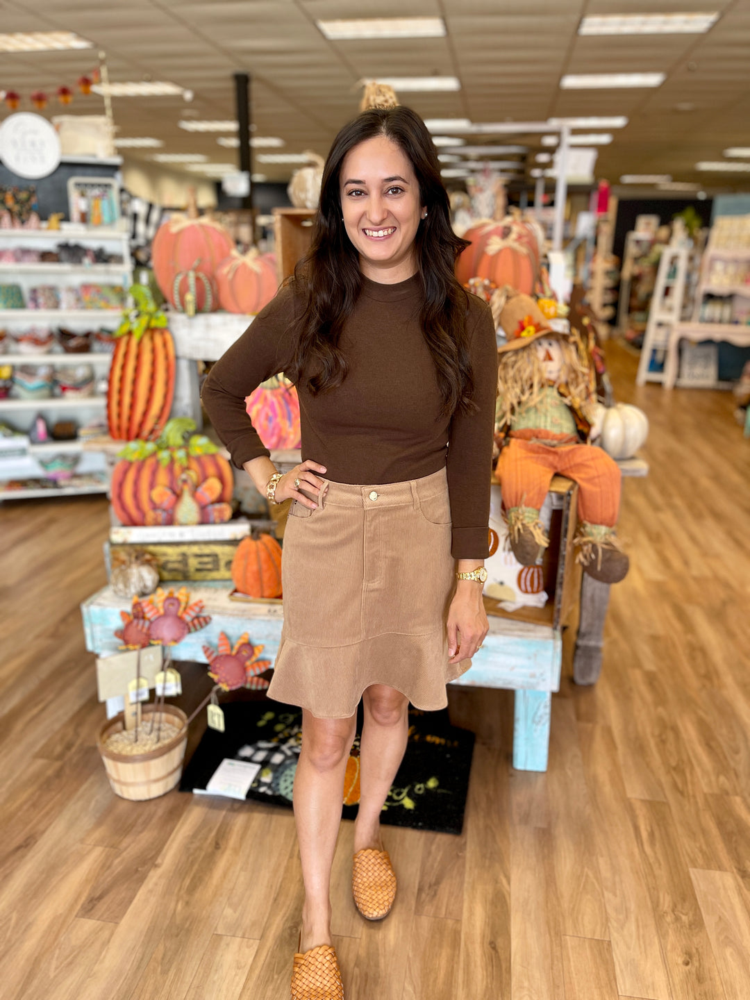 khaki, corduroy mini skirt with pockets and small ruffle at bottom